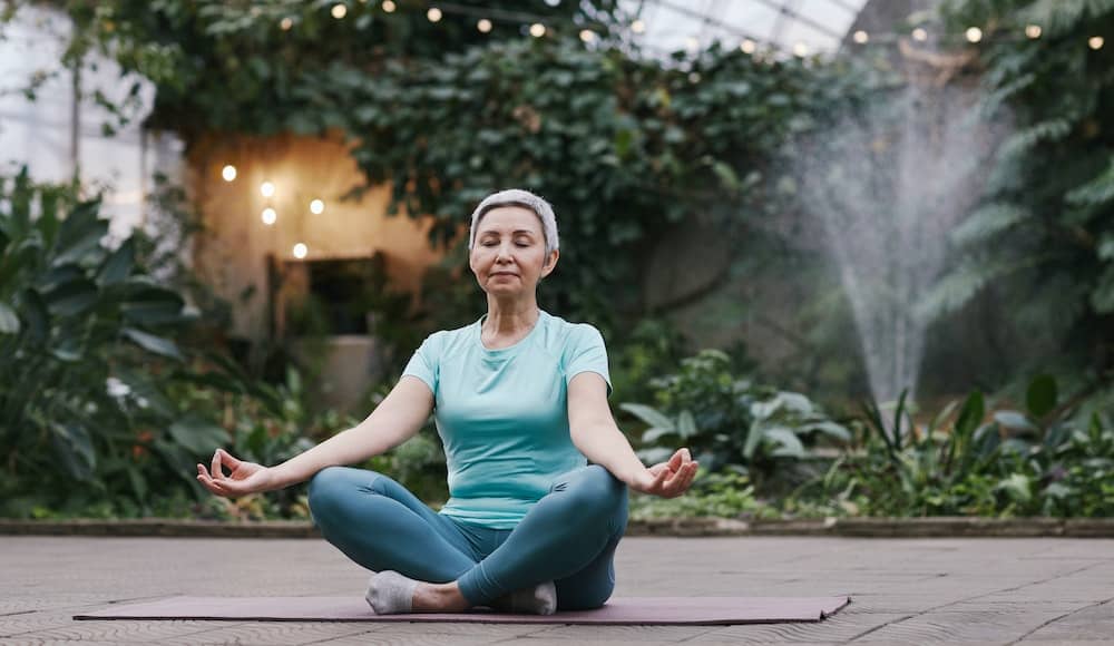 Woman doing yoga focusing on her spiritual health