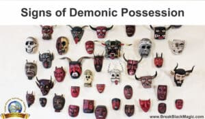 Signs of demonic possession, 42 different evil looking masks hanging on a wall.