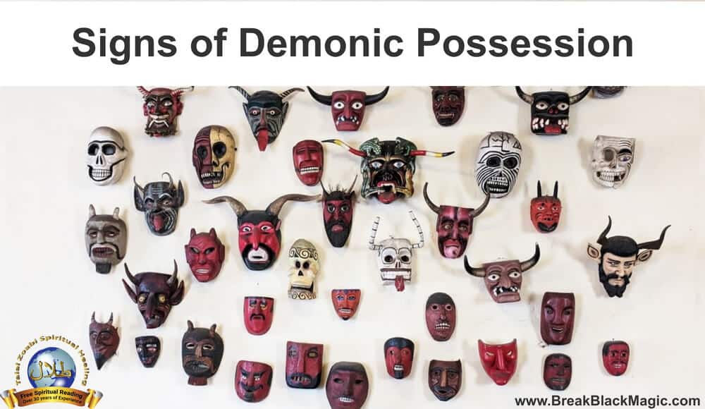 Signs of demonic possession, 42 different evil looking masks hanging on a wall.