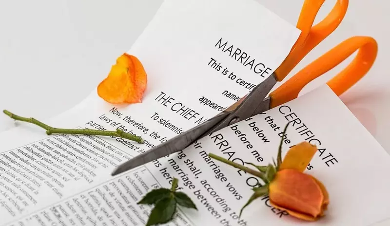 How to fix a broken marriage, orange scissors and petals.