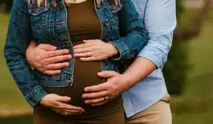Increase chances of pregnancy, Man and woman holding woman's pregnant belly.