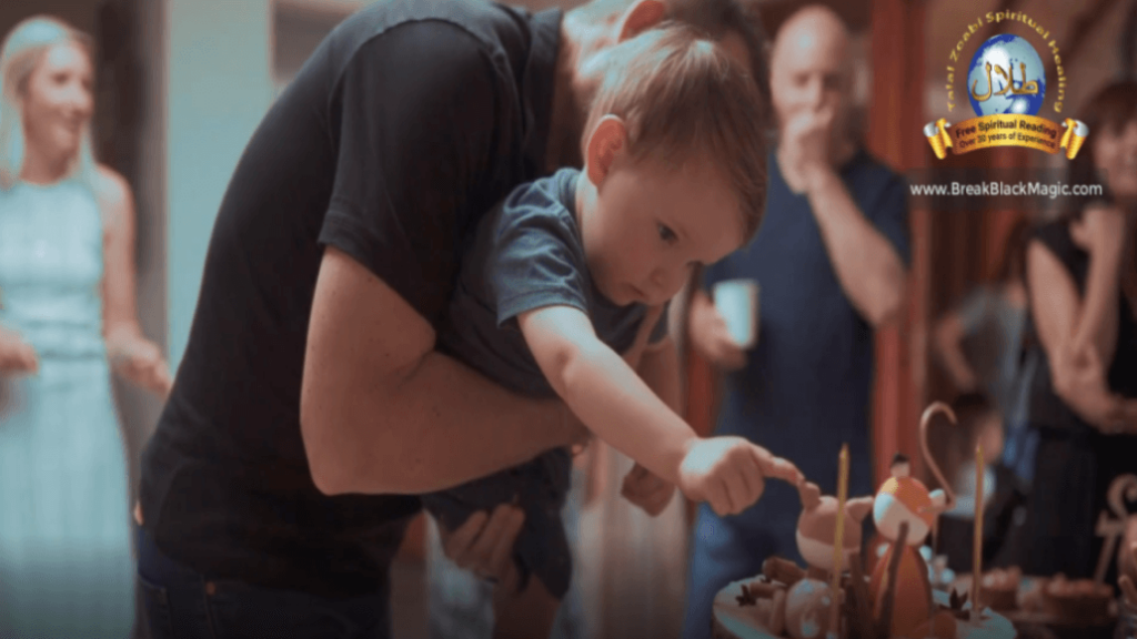 Generational curses, a man holding a toddler boy touching a birthday cake.