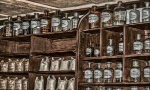 black magic remedy items on a shelf in bottles.