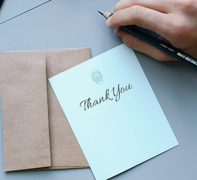 Card that says thank you on it with envelope, spiritual healing testimonial.