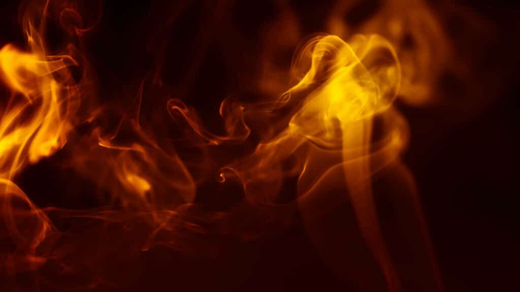 How to get rid of evil spirits. Flame and smoke with black background