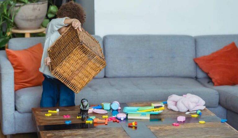 A toddler playing with toys. Signs good luck is coming.