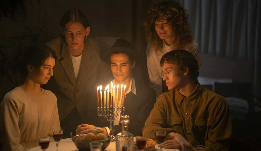 Family sitting at table searching for how to remove a curse.