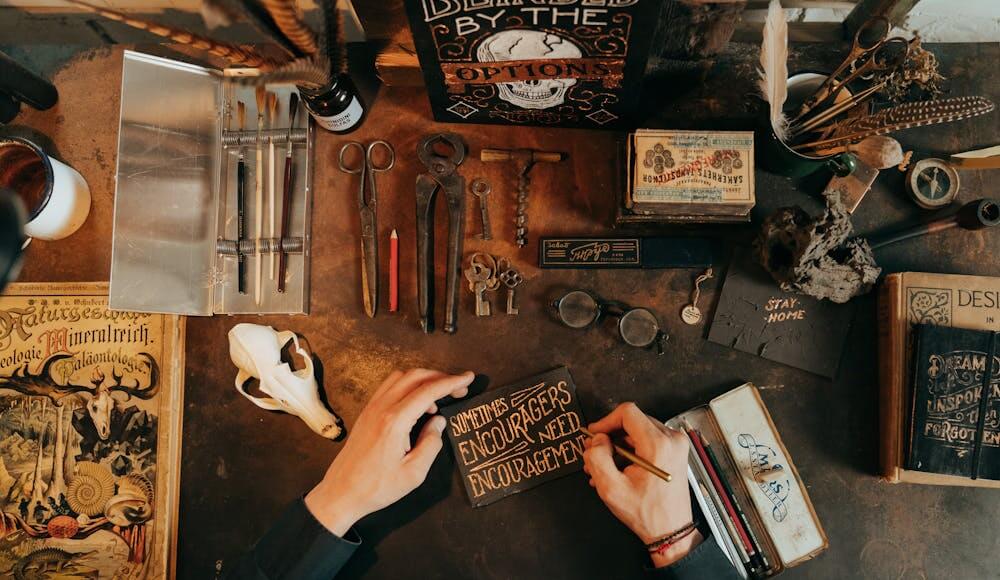 Tools on a table with a skull to send symptoms of witchcraft.